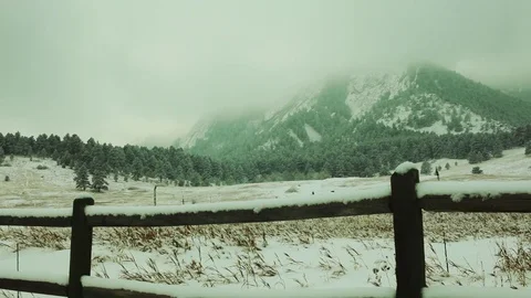 Gentle snowfall on the front range of the Rocky Mountains Video stock 84783486