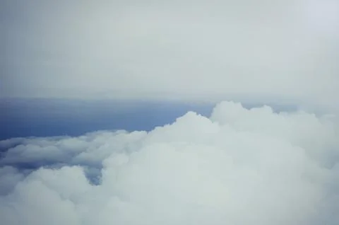 Gentle soft clouds view from the plane , cold colors, textures Stock Photos