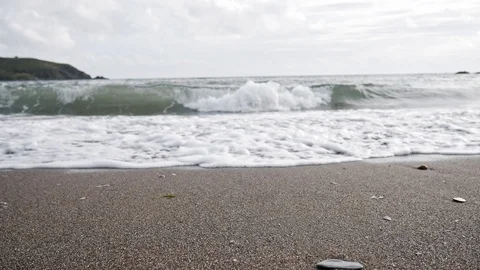 Gentle soft waves coming into shore on a beach Stock Footage 114608546