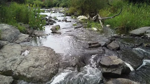 A gentle stream among the rocks Stock Footage 138649733