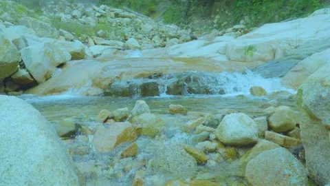 Gentle Stream Flowing Over Rocks | Peaceful Nature Sounds and Calming Scenery Stock Footage 286934914