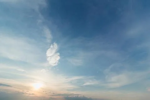Gentle sunset sky with soft light clouds in delicate vanilla tones. Peaceful  Stock Photos
