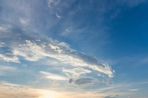 Gentle sunset sky with soft light clouds in delicate vanilla tones. Peaceful  Stock Photos