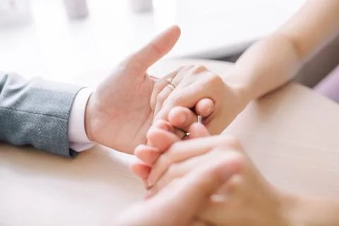 Gentle touch of the hands of a man and a woman. husband gently strokes his wi Stock Photos