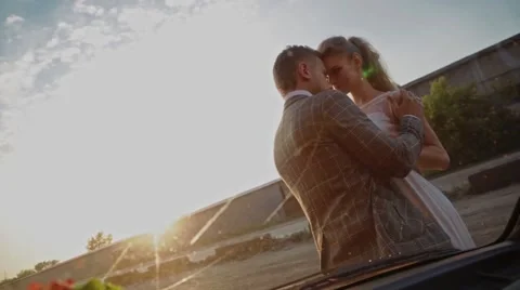 The gentle touch of the newlyweds in the sunrays Stock Footage 61276170