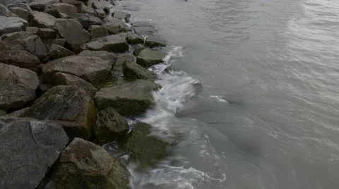 Gentle wave hit over the causeway stones Stock Footage 50810079