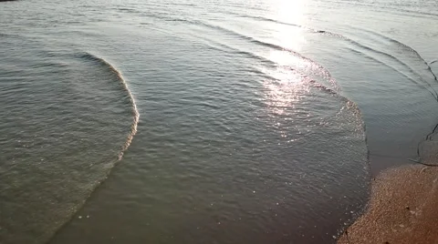Gentle wave with sun reflection at seashore Stock Footage 50796686