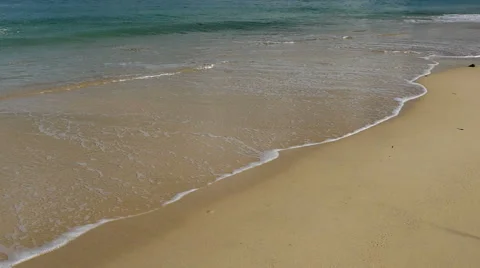 Gentle wave weashing up sandy beach, slow motion Stock Footage 58043238