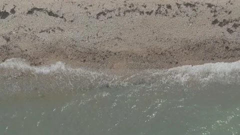 Gentle Waves against Beach Overhead Drone Shot Stock Footage 172362258