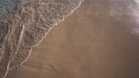 Gentle waves and sandy beach at Cala Marsal near Portocolom Stock Footage 325847597
