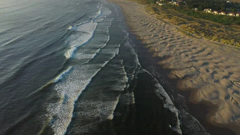 Gentle waves at a beach during magic hour Stock Footage 152622662