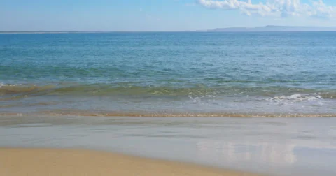 Gentle waves at a beautiful beach - 4K (UltraHD) Stock Footage 39748637