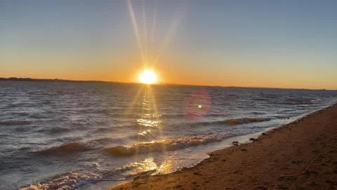 Gentle waves breaking along the shoreline at Wellington Point as the setting Stock Footage 345544474