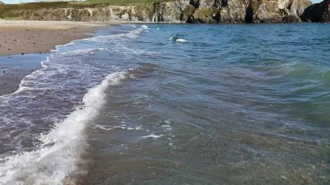 Gentle Waves on Bunmahon Beach Celtic Sea 4K Stock Footage 333414528