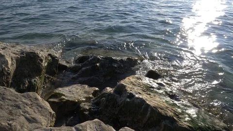 Gentle Waves Hitting Rocks at the Beach Video stock 120804884