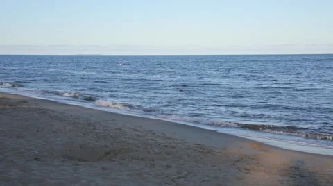 Gentle waves lapping along a Cape Cod beach on a summer day 스톡 동영상 59712256