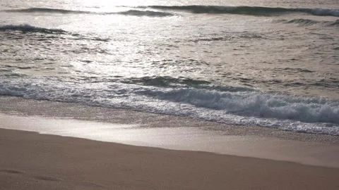 Gentle waves lapping on shore of beach at dusk Stock Footage 172484898