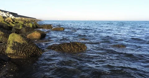 Gentle Waves Lapping the Shore Stock Footage 128355183