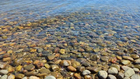 Gentle Waves Over Rocks Stock Footage 239245441