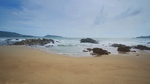 Gentle Waves over Rocks at Phuket Tropical Beach Stock Footage 85484814