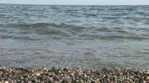 Gentle Waves on Pebbled Beach 動画素材 753914
