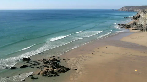 Gentle waves reach the sandy beach at Porthtowan. Vídeo Stock 731609
