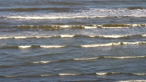 Gentle waves roll onto the shore of the Caspian Sea in Iran Stock Footage 336247677
