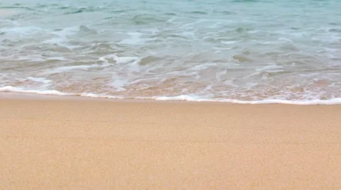 Gentle Waves Roll onto a Tropical Beach. Video 4k Stock Footage 60802933