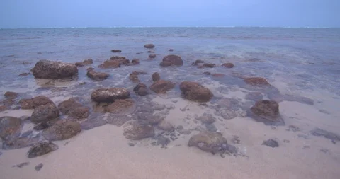 Gentle Waves Rolling in Over Shallow Rocks in Hawaii Stock Footage 104402996