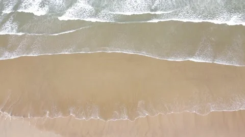 Gentle Waves Rolling on Sandy Ocean Beach Top Down View Stock Footage 196404232