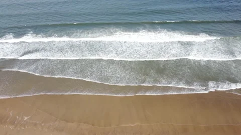 Gentle Waves Rolling on Sandy Ocean Beach Top Down View Stock Footage 196410113
