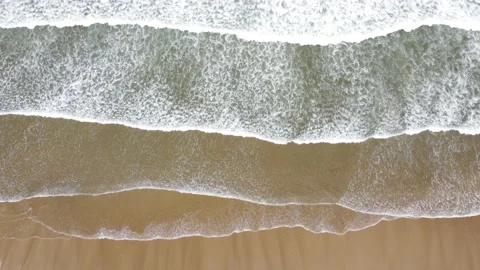 Gentle Waves Rolling on Sandy Ocean Beach Top Down View Stock Footage 196411749