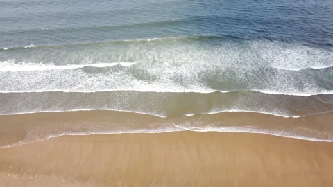 Gentle Waves Rolling on Sandy Ocean Beach Top Down View Stock Footage 196414565