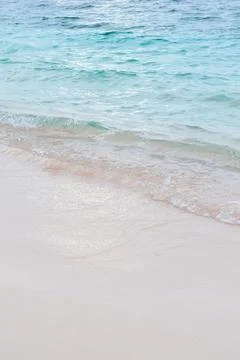 Gentle Waves on a Sandy Beach Stock Photos