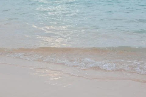 Gentle Waves on a Sandy Beach Stock Photos