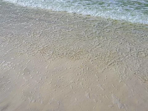 Gentle Waves on Sandy Shore 库存照片