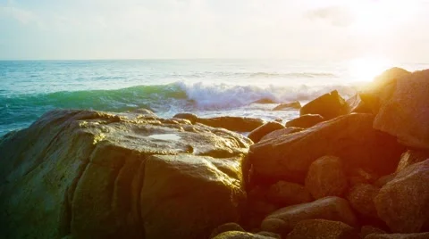 Gentle Waves Splash against Boulders in the Late Afternoon. UltraHD video 库存影片 59796256