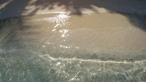 Gentle Waves Splash over Sandy Tropical Beach with Sound Stock Footage 75004434