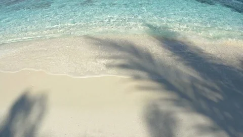Gentle Waves Splash over White Sand at this Tropical Beach Paradise Stock Footage 75004901