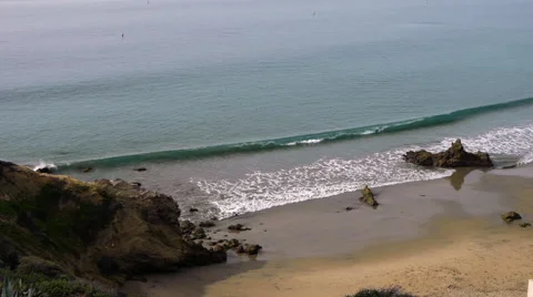 Gentle waves splash on the rocks Stock Footage 54566181