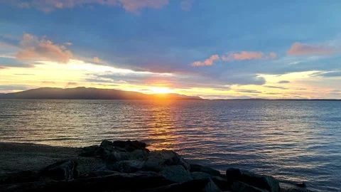 Gentle Waves at Sunset 4K30FPS Video stock 306036200