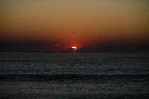 Gentle waves while the sun is rising over the Black Sea in the Obzor resort i Stock Photos