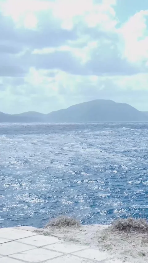 Gentle wind creating ripples on a tranquil water surface Video stock 294963926