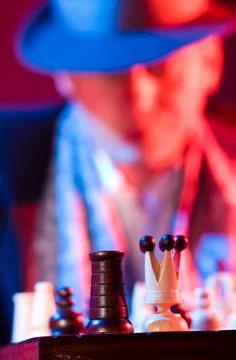Gentleman in hat playing chess Stock Photos