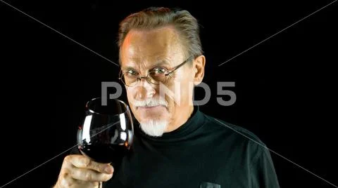 Gentleman testing wines in the winery. Stock Photos