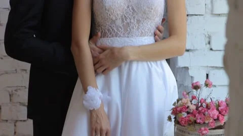 Gently connected hands of a newly-married couple with wedding rings on a finger Stock Footage 54445518