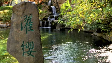 Gently Flowing Stream with Ripples and Clear Water Stock Footage 320167386