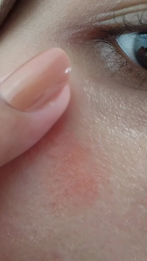 Gently touching the cheek area where blush on is applied. Process of blendi.. Stock Footage 332227574