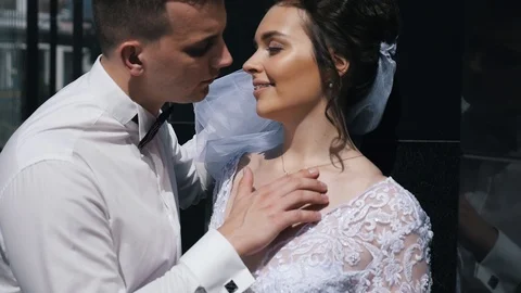 Gently touching the groom to the bride in portrait terms Stock Footage 107657997