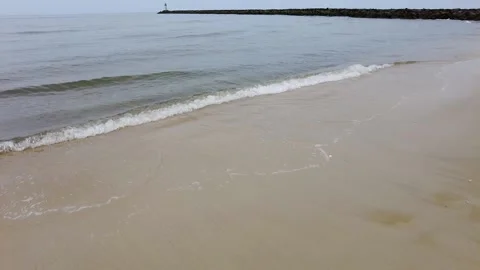 Gently waves on a sandy beach Stock Footage 154711954